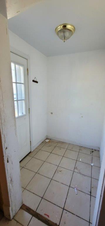 empty room with light tile patterned floors