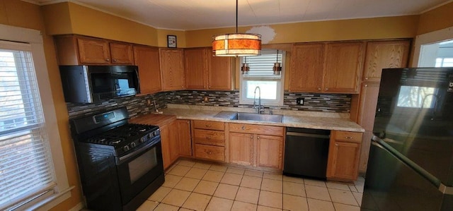 kitchen with sink, pendant lighting, decorative backsplash, black appliances, and ornamental molding