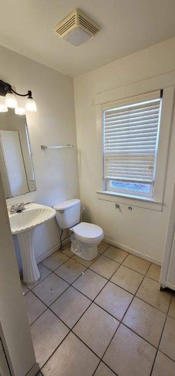 bathroom featuring tile patterned floors and toilet