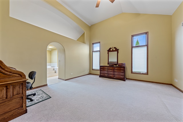 carpeted office with ceiling fan and lofted ceiling