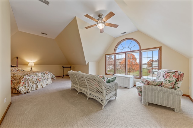 carpeted bedroom with ceiling fan and vaulted ceiling