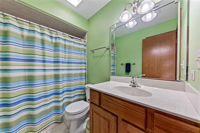 bathroom with tile patterned floors, walk in shower, vanity, and toilet