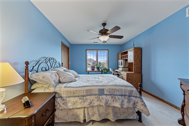 bedroom with ceiling fan and carpet floors