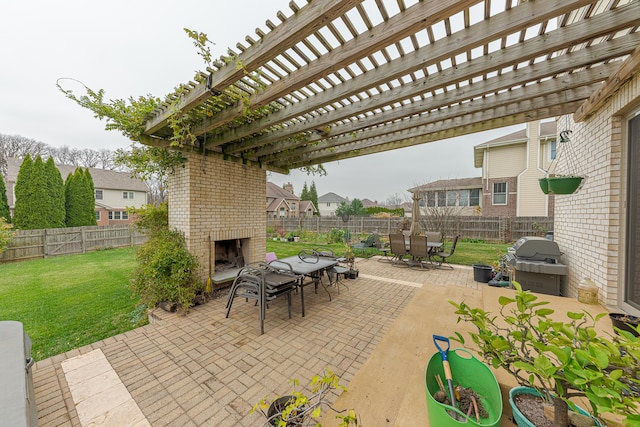 view of patio / terrace featuring a pergola, an outdoor brick fireplace, and grilling area