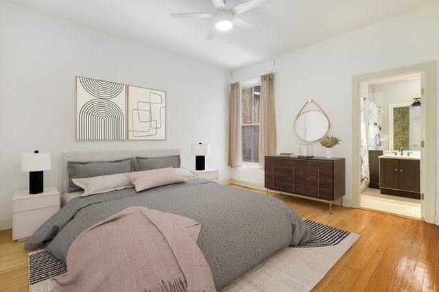 bedroom featuring hardwood / wood-style floors, ensuite bathroom, ceiling fan, and sink