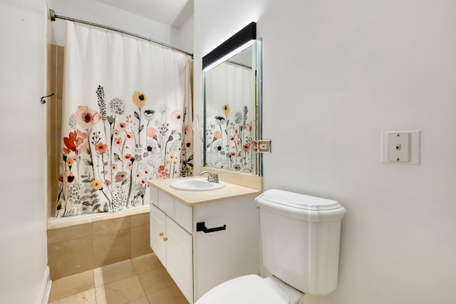 full bathroom featuring tile patterned flooring, vanity, toilet, and shower / bath combo with shower curtain