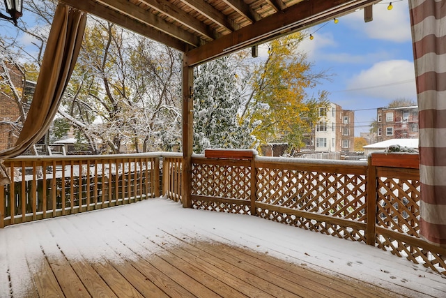 view of snow covered deck