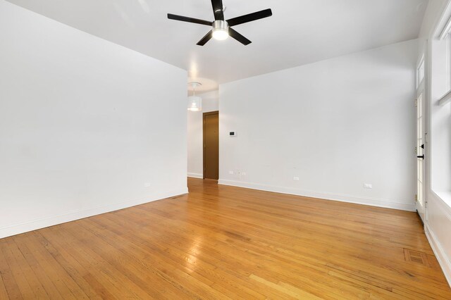 spare room featuring ceiling fan and light wood-type flooring