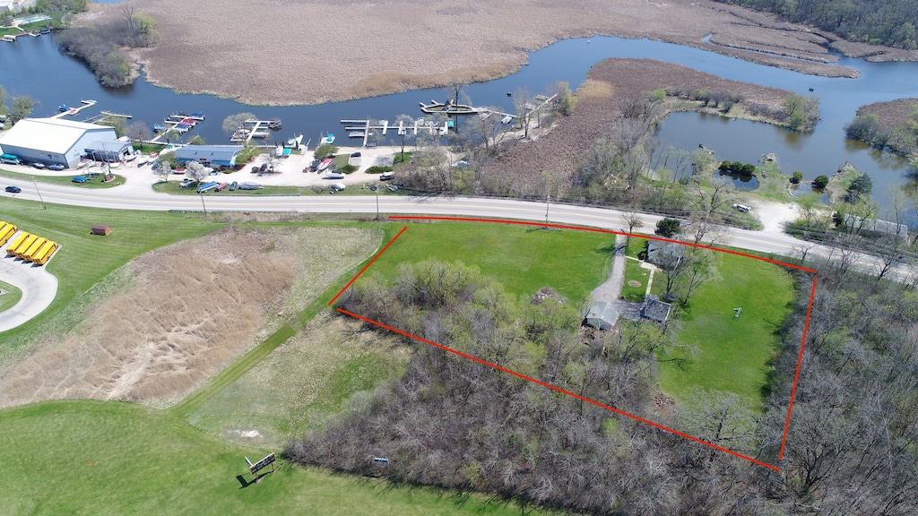 birds eye view of property featuring a water view