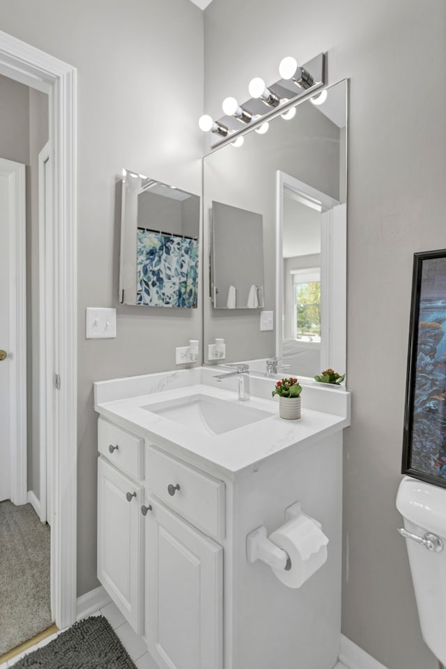 bathroom with vanity and toilet