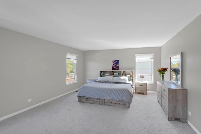 bedroom featuring light colored carpet