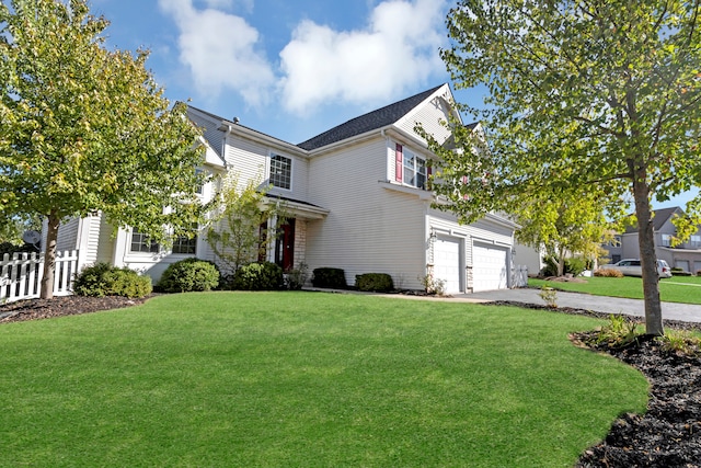 view of front of home featuring a garage and a front lawn