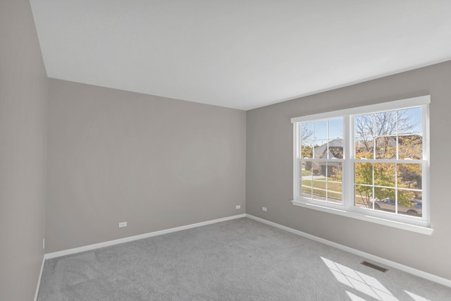 empty room featuring light carpet