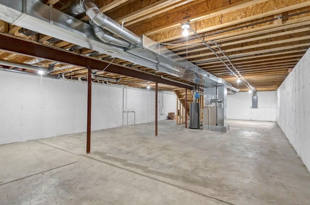 basement with electric panel and gas water heater