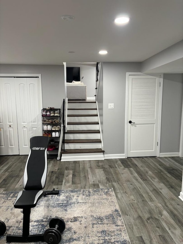 exercise room with dark hardwood / wood-style flooring