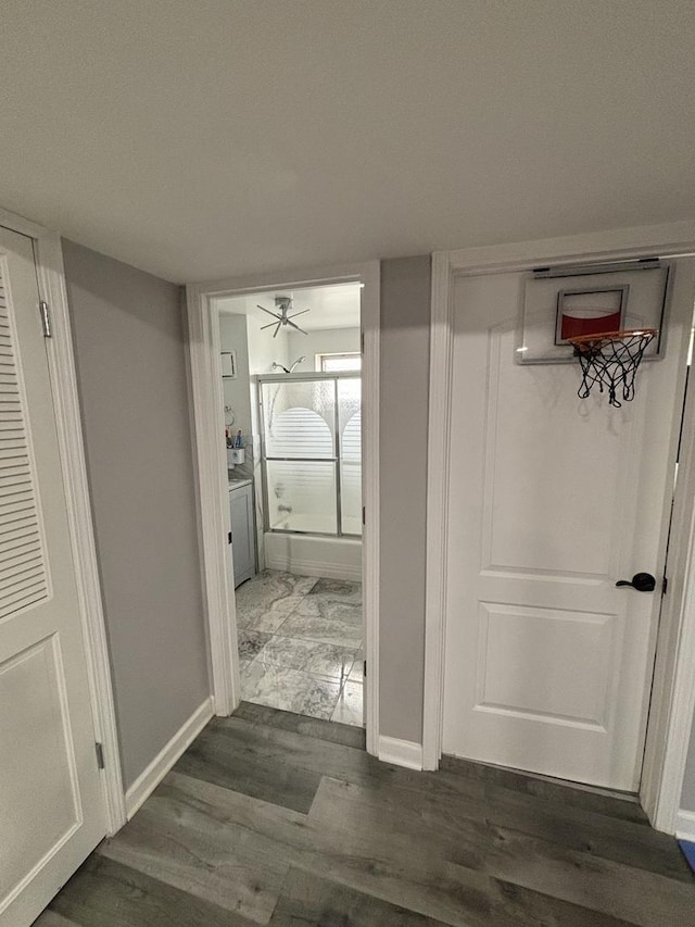 hallway with dark hardwood / wood-style floors