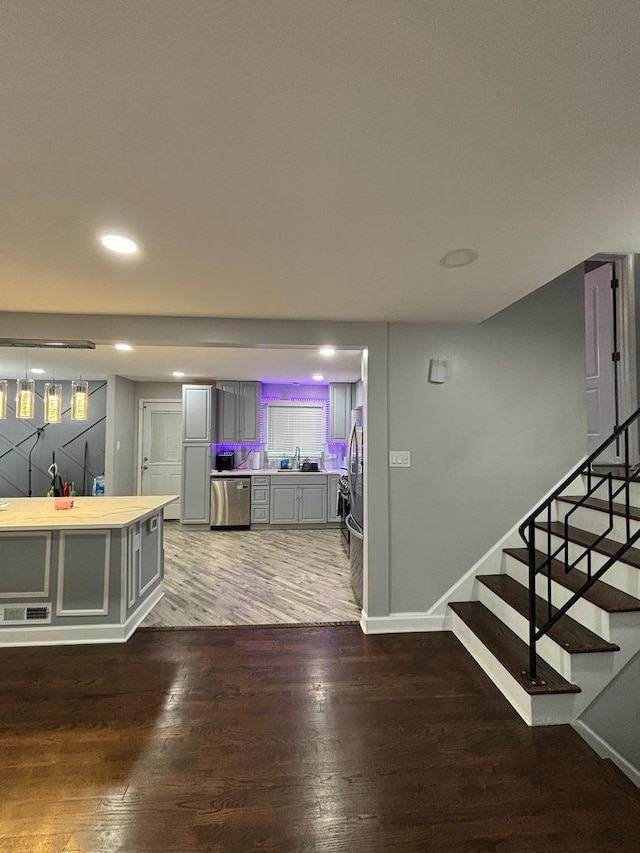 interior space with sink and dark wood-type flooring