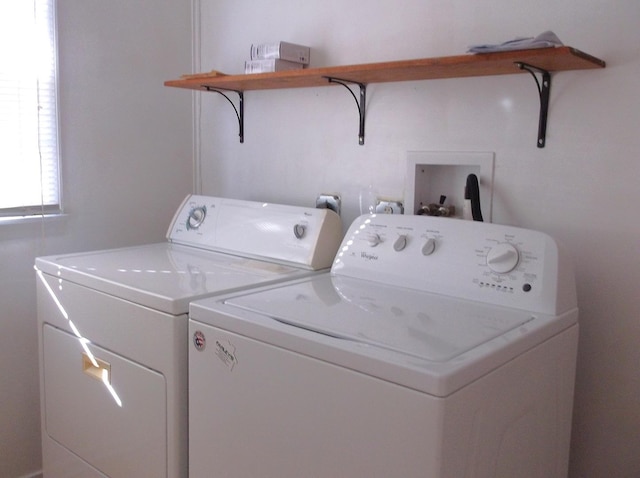 clothes washing area featuring laundry area and washing machine and dryer