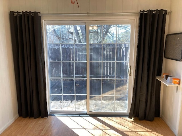 entryway with wood finished floors