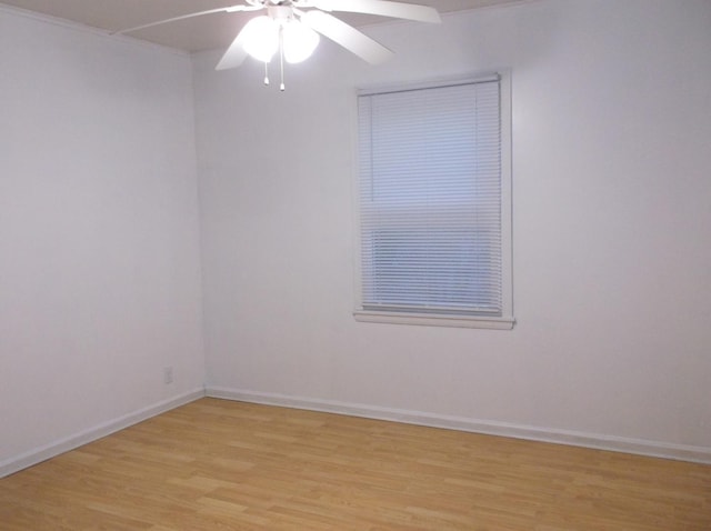 empty room with light wood-style flooring, baseboards, and ceiling fan