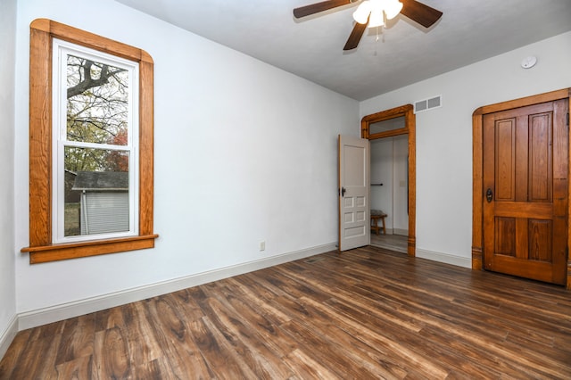 unfurnished bedroom with dark wood-type flooring and ceiling fan