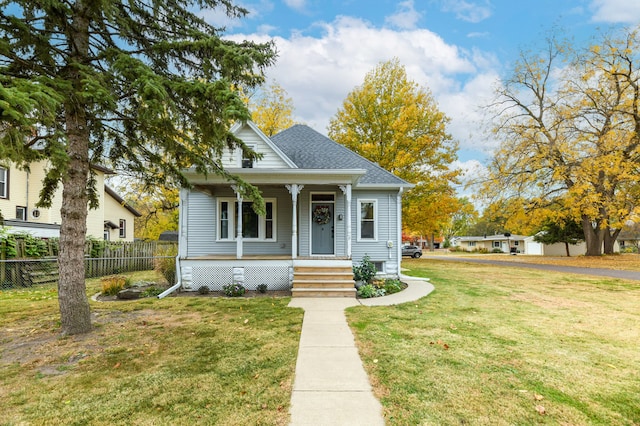 bungalow-style home featuring a front yard and a porch