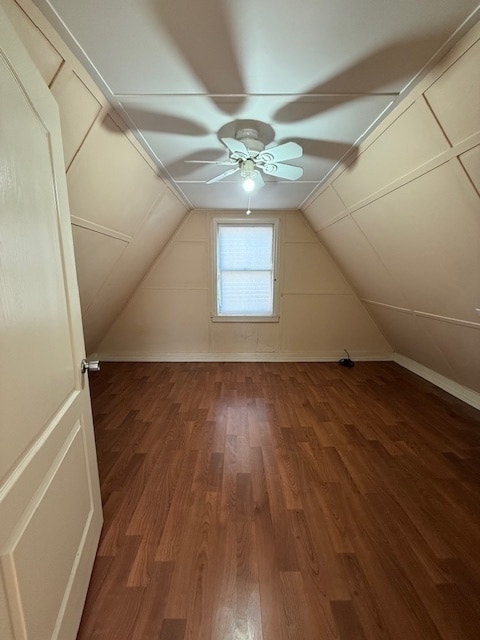 additional living space with wood-type flooring, ceiling fan, and lofted ceiling