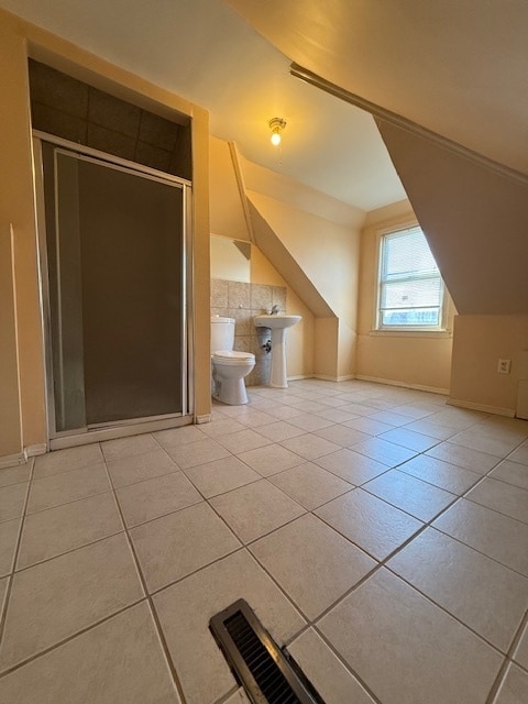 additional living space featuring light tile patterned flooring