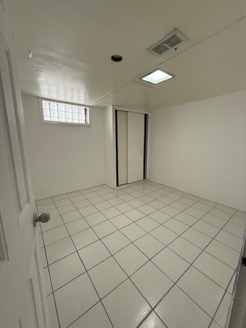 basement with light tile patterned floors