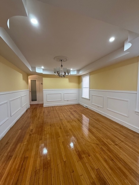 interior space featuring a chandelier and hardwood / wood-style flooring