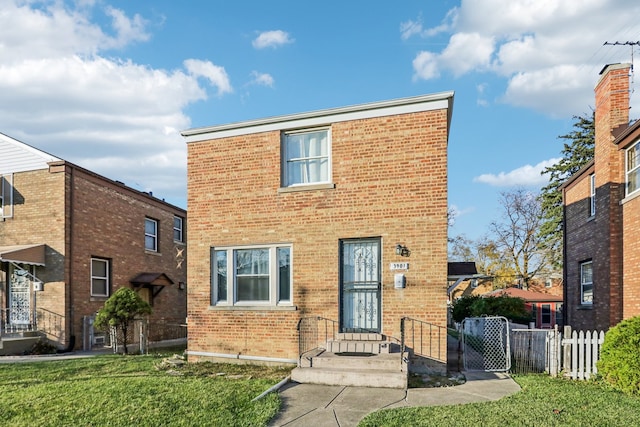 front facade featuring a front lawn