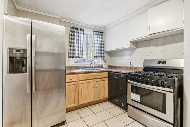 kitchen with appliances with stainless steel finishes, backsplash, crown molding, sink, and light tile patterned floors