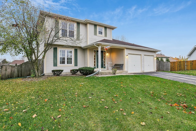 front of property featuring a garage and a front lawn