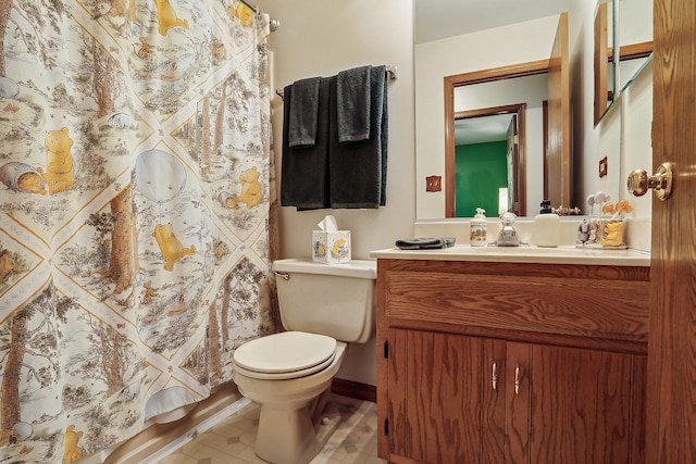 bathroom featuring vanity and toilet