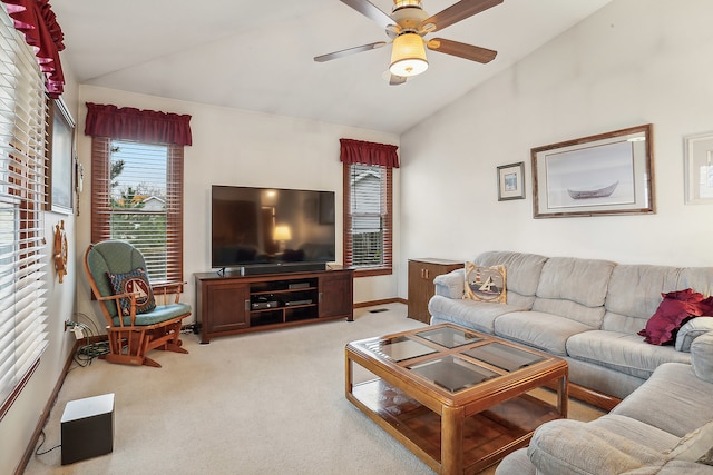 living room featuring ceiling fan, light carpet, and vaulted ceiling