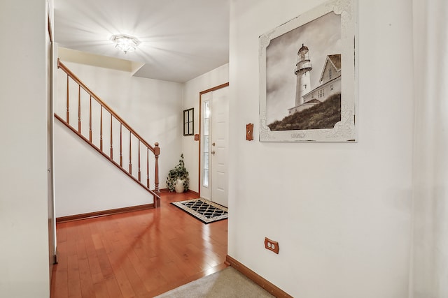 entryway with wood-type flooring