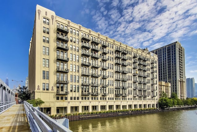 view of building exterior with a water view