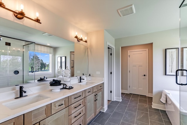 bathroom with vanity and separate shower and tub