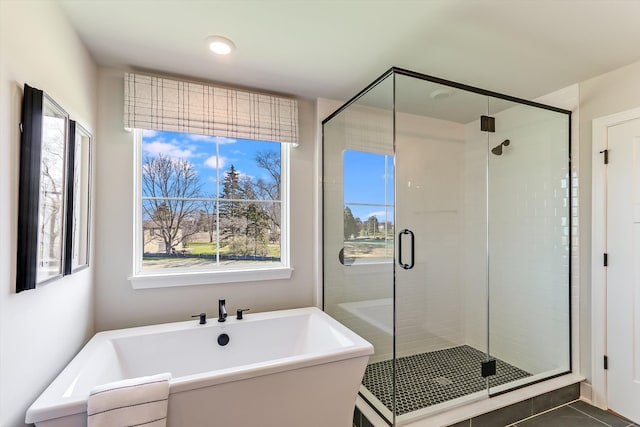 bathroom with tile patterned flooring and plus walk in shower