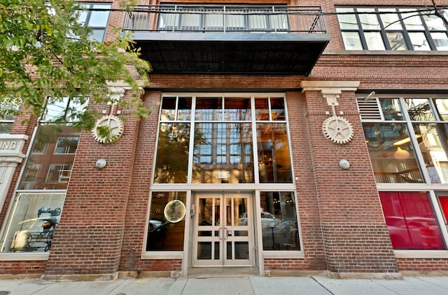 entrance to property featuring a balcony