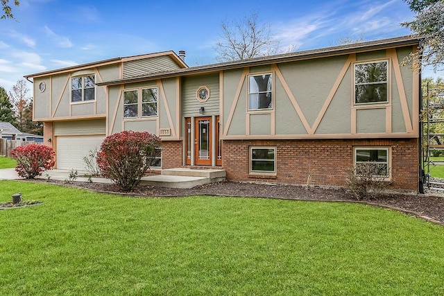 bi-level home with a front yard and a garage