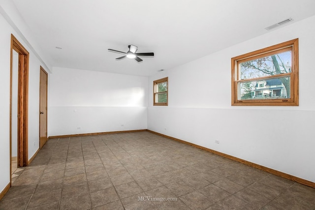 unfurnished room with ceiling fan