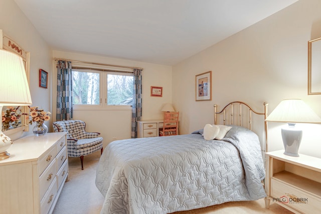 bedroom featuring light colored carpet