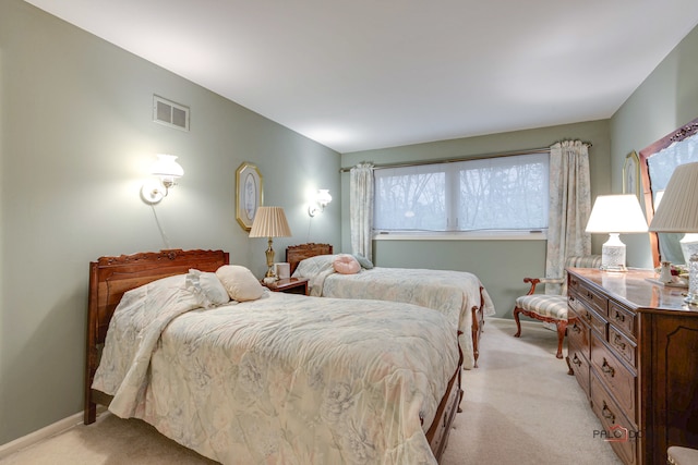 bedroom featuring light colored carpet