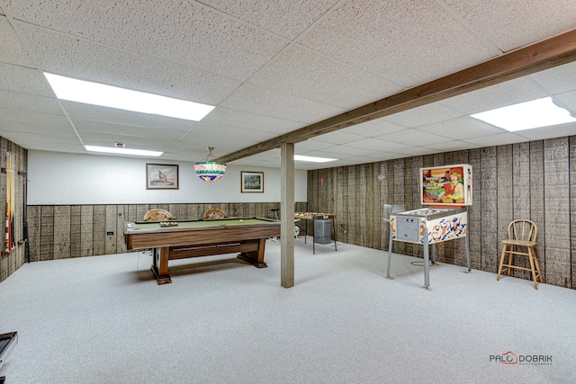 recreation room with a drop ceiling, wood walls, carpet floors, and pool table