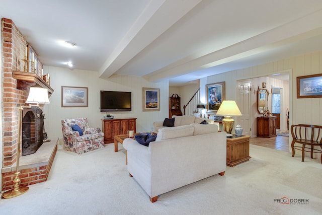 carpeted living room with a fireplace