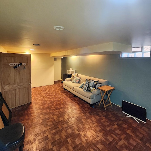 living room featuring dark parquet flooring