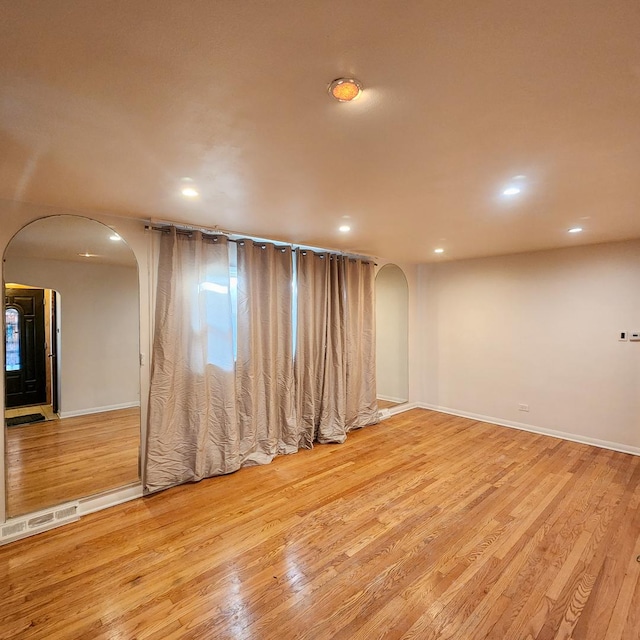 spare room with light wood-type flooring