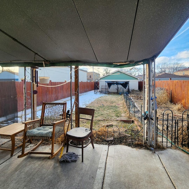 view of patio / terrace with a storage shed