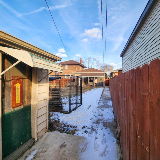 view of yard layered in snow